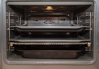 Image showing Open oven with tray