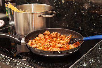 Image showing Cooking meat balls with pasta