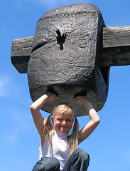 Image showing Girl under large hammer