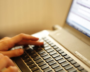 Image showing Young woman working on laptop