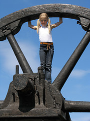 Image showing Little girl and large wheel