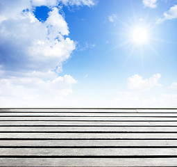Image showing blue sky and wood floor background