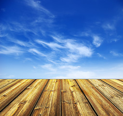 Image showing blue sky and wood floor background