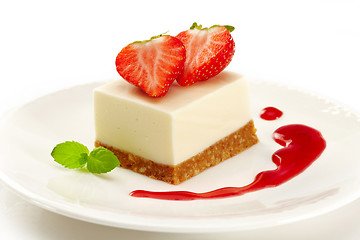 Image showing cheesecake with strawberries on white plate