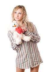 Image showing Thoughtful blonde holding teddy bear