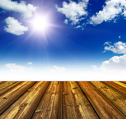 Image showing blue sky and wood floor background
