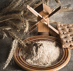 Image showing Wholemeal flour and wheat on cloth sack, close-up