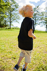 Image showing Boy jumping outdoors