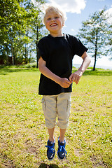 Image showing Boy jumping outdoors