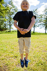 Image showing Boy jumping outdoors