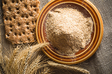 Image showing Wholemeal flour and wheat on cloth sack, close-up