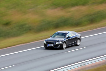 Image showing Fast Black Car on Motorway