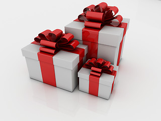 Image showing white gift boxes with ribbons and bows isolated on white backgro
