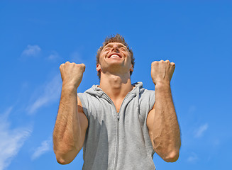 Image showing The winner, happy energetic young man