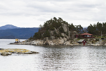 Image showing house at coastline on small island