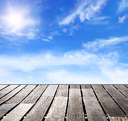 Image showing blue sky and wood floor background