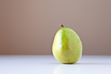 Image showing Green Pear on White with Brown Background