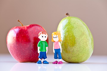 Image showing Girl and Boy Discussing Healthy Nutrition (Pear and Apple)