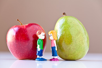 Image showing Girl and Boy Discussing Healthy Nutrition (Pear and Apple)