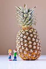 Image showing Girl and Boy Discussing Healthy Nutrition (Pineapple)