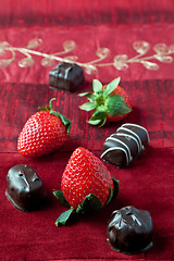 Image showing Strawberries and Chocolates on Red Background