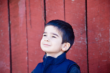 Image showing Little Boy Joyfully Gazing Up at the Sky