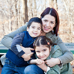 Image showing Happy Mother Hugging Her Children