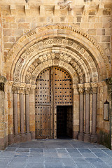 Image showing Open Old Church Door with Stone Arches and Columns 