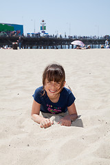 Image showing Little Girl Lying on the Beach