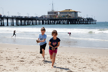 Image showing Girl and Boy Playing on the Beach
