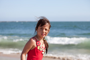 Image showing Puzzled Little Girl on the Beach