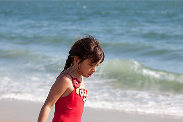 Image showing Little Girl Relaxing by the Ocean