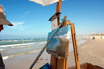 Image showing A painter on the beach.