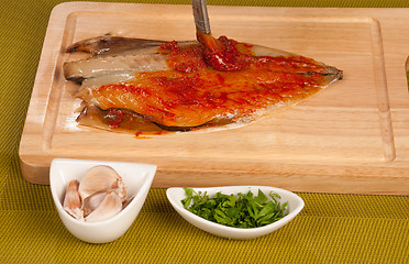 Image showing Marinating a mackerel