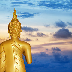 Image showing Buddha statue at sunset. Rear view.