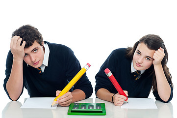 Image showing Confused students holding their heads during examination