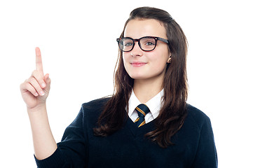 Image showing Smart girl draws the attention of teacher