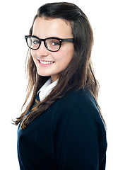 Image showing Side view of an adorable teenager wearing spectacles