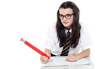 Image showing Snap shot of calm and relaxed young schoolgirl