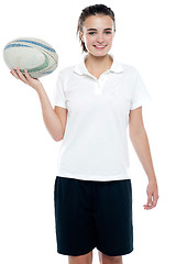 Image showing Lovely isolated caucasian teenager with a football