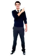 Image showing Full length portrait of teenager pointing away