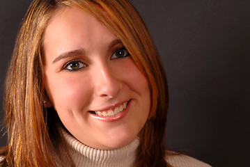 Image showing Full face view of an attractive happy young woman