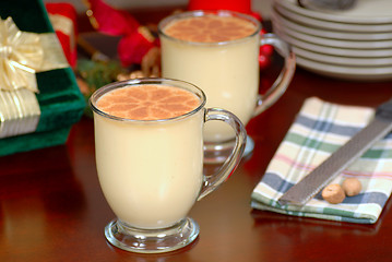 Image showing Two glasses of rich eggnog in a holiday table setting