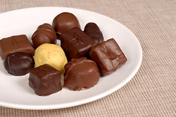 Image showing Variety of chocolates on a white plate