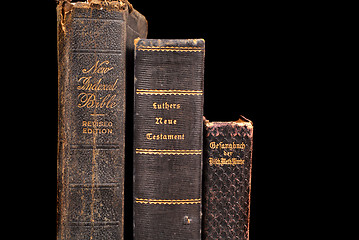 Image showing Three very old bibles including two German bibles