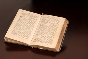 Image showing An open old German bible resting on a table