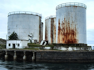 Image showing Old huge rusty oil tanks