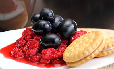 Image showing dessert of raspberry and grapes