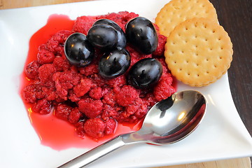 Image showing red grapes and  wild raspberry