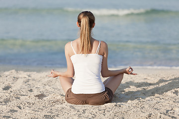 Image showing Woman doing yoga on the beach Sports Landscape